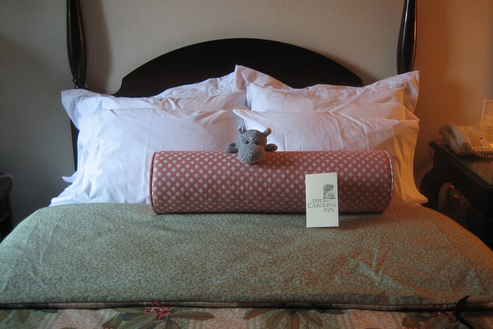 stuffed hippo on bed